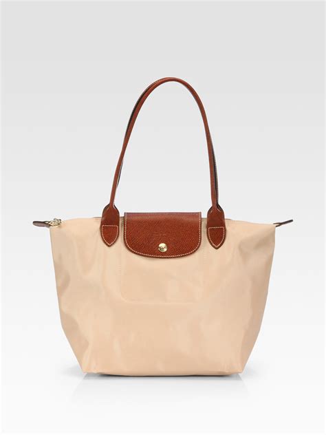 longchamp le pliage beige medium.